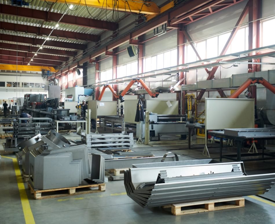 Wide angle background shot of empty factory workshop with machines ready for assembling, copy space